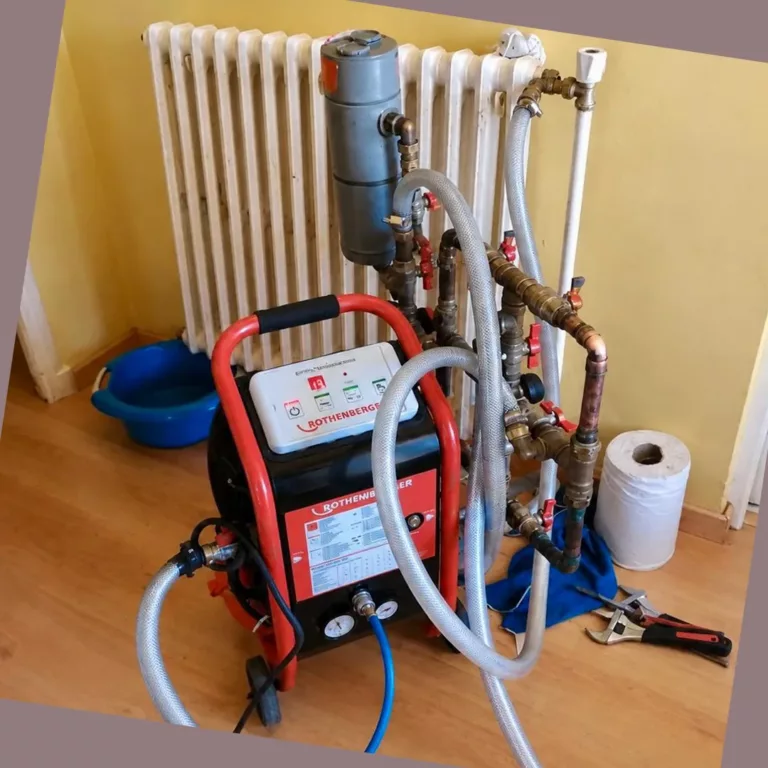 Machine de désembouage raccordée à un radiateur en fonte pour nettoyer le circuit de chauffage